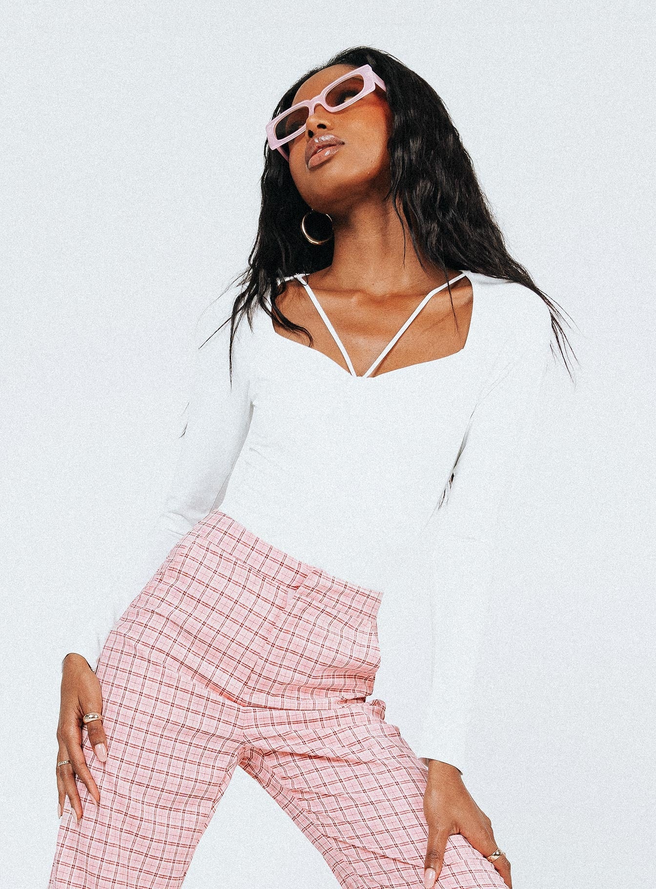 side view of model wearing Princess Polly Tori Long Sleeve Bodysuit White Full Sleeves Sweetheart 