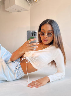 side view of model wearing Princess Polly Harlow Long Sleeve Top White 