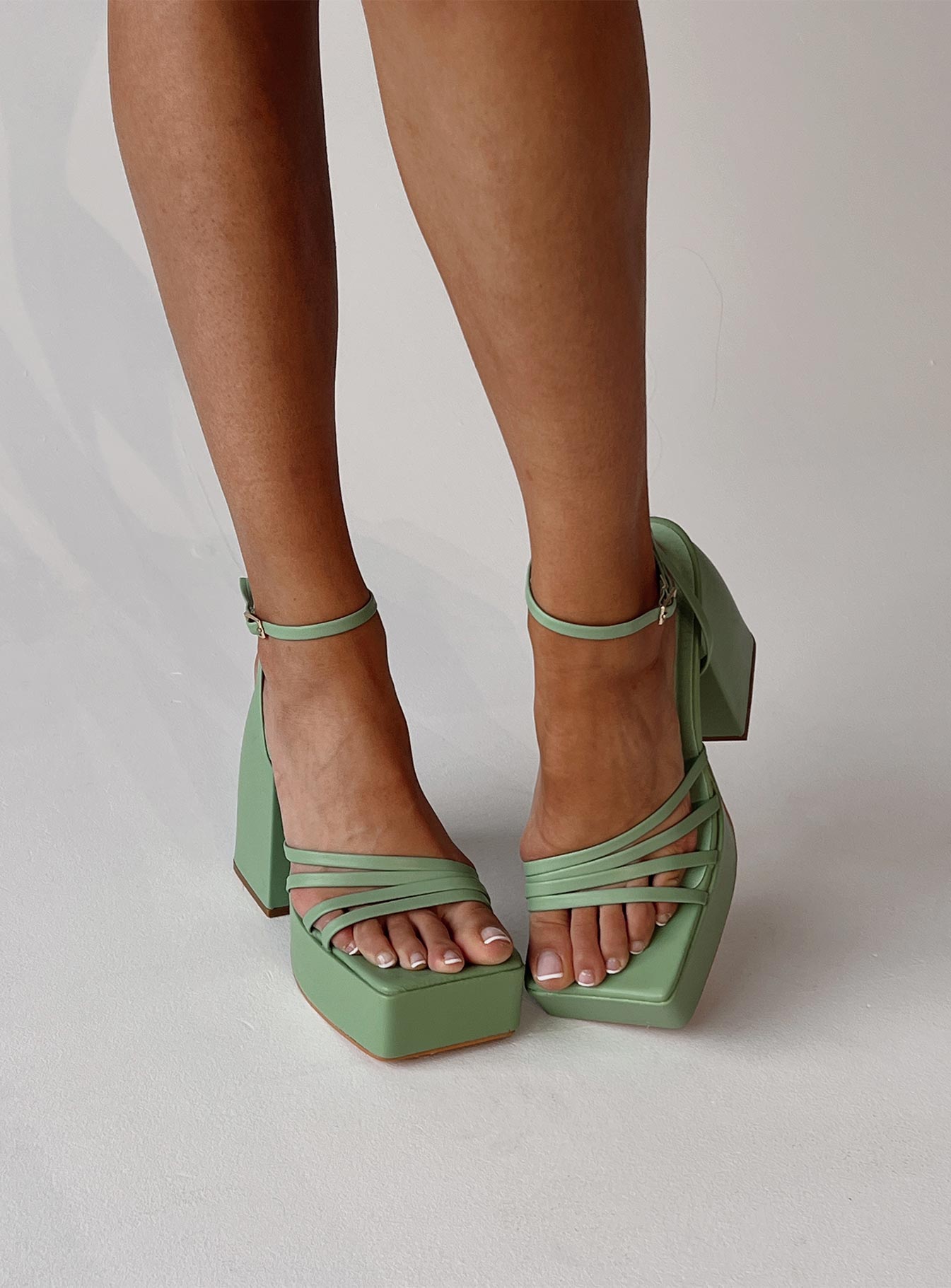 Heels  Princess Polly Exclusive Faux leather material  Strappy upper  Ankle wrap strap  Buckle fastening  Platform base  Block heel 