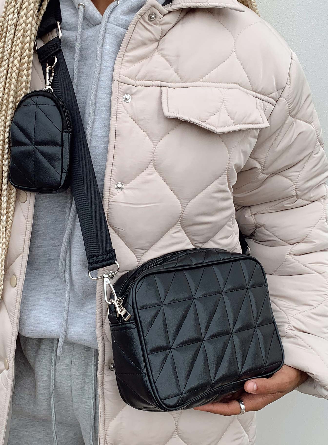 Crossbody bag  70% PU 20% polyester 10% nylon Faux leather  Quilted material  Silver-toned hardware  Zip fastening  Removable & adjustable crossbody strap  Removable coin purse on strap  Flat base 