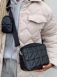 Crossbody bag  70% PU 20% polyester 10% nylon Faux leather  Quilted material  Silver-toned hardware  Zip fastening  Removable & adjustable crossbody strap  Removable coin purse on strap  Flat base 