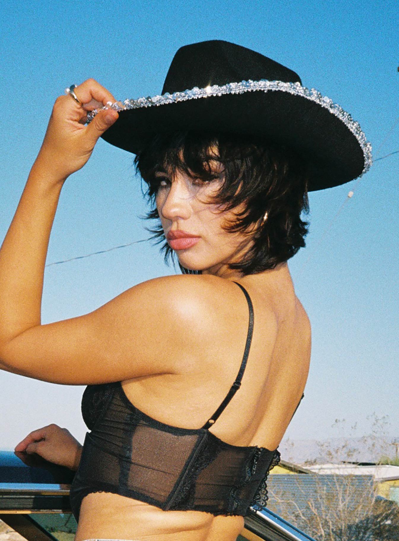 Cowboy hat 50% polyester 50% acrylic Faux felt material  Sequin rim & headband  Stiff curved brim  OSFM 