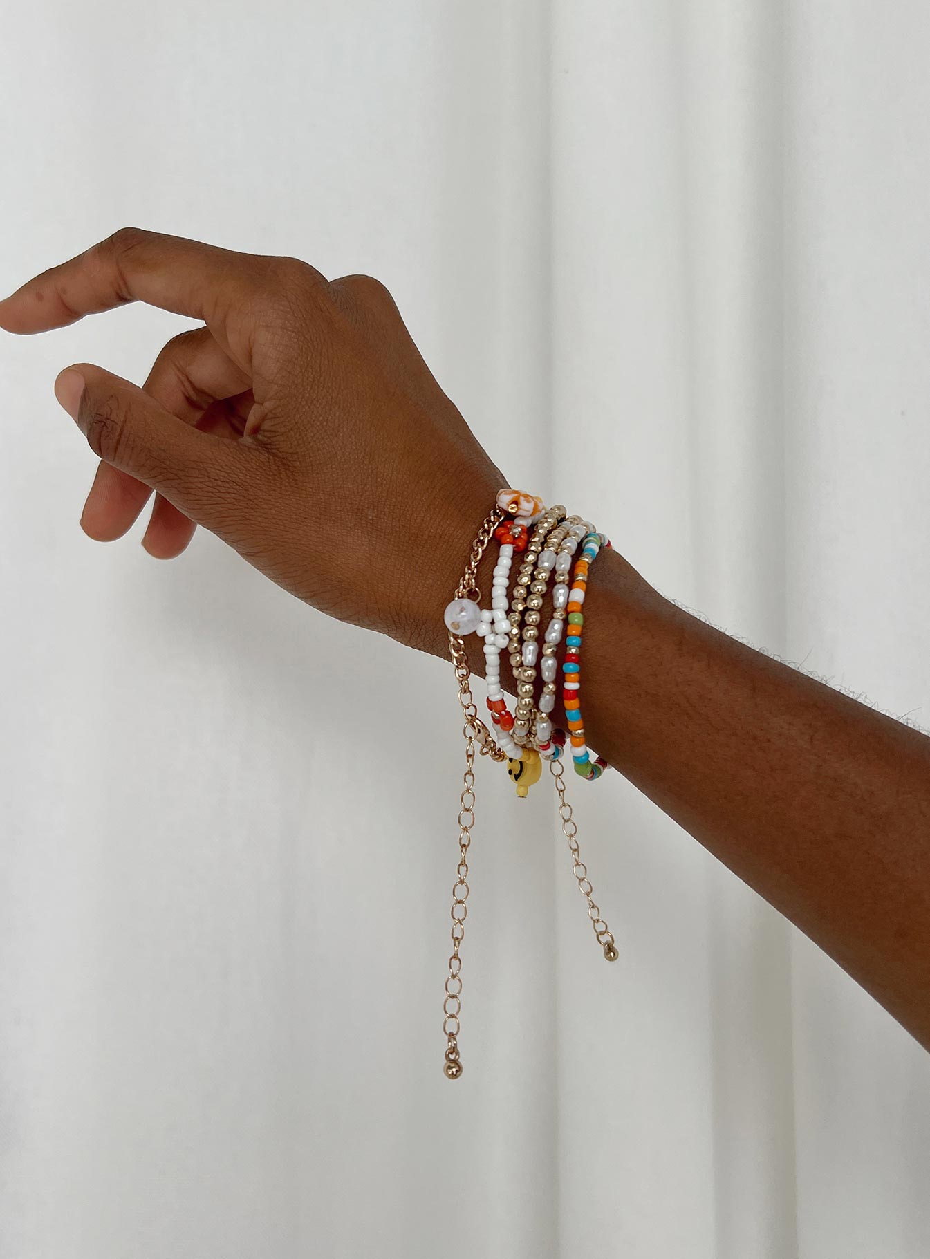 Bracelet set Pack includes six bracelets These can be worn separately Colourful beads & charms Four elasticated bands Two adjustable with lobster clasp fastening