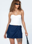 Front view of model wearing  front Motel Valita Mini Skirt Denim Princess Polly  Mini Skirts 