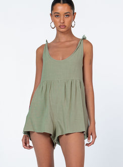 Romper loose fitting Linen look material  Tie shoulder straps  Wide neckline  Gathered waist  Twin hip pockets 