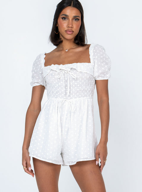 White romper Sheer design  Floral stitched material  Elasticated shoulders Puff sleeves Frill neckline  Shirred bust Fixed tie at waist 