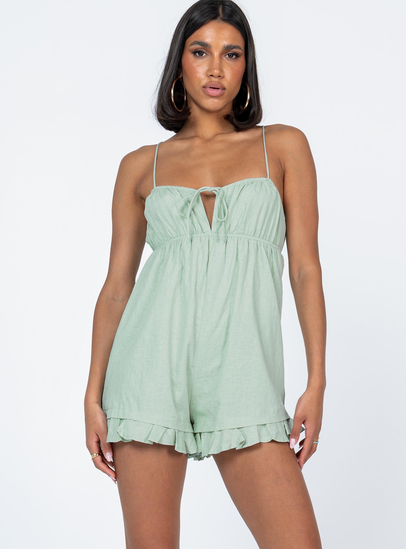 Romper Elasticated neckline & waistband  Tie fastening at bust  Tie back straps  Invisible zip fastening  Frill hem 