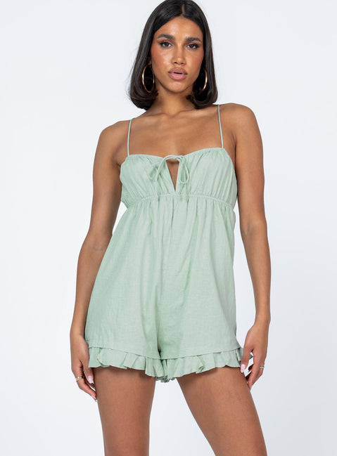 Romper Elasticated neckline & waistband  Tie fastening at bust  Tie back straps  Invisible zip fastening  Frill hem 