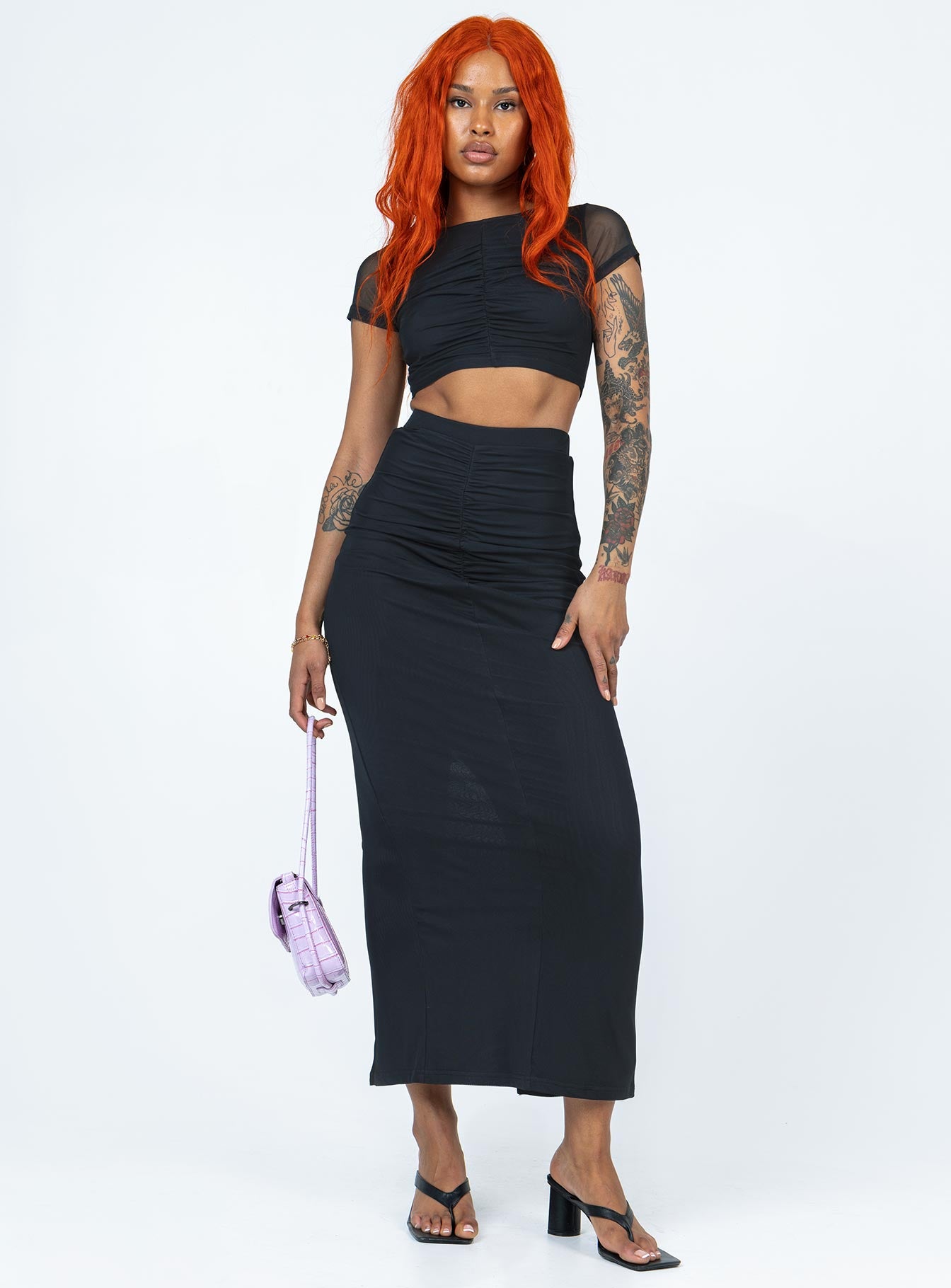 Matching set Mesh material  Ruched front  Cropped tee  High waisted skirt  High back slit 