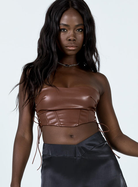 front view of model wearing Princess Polly Maddox PU Strapless Top Brown 