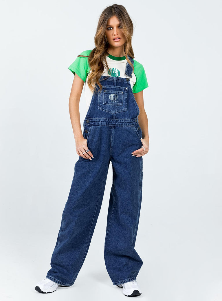 Overalls Dark wash denim  Embroidered graphic at chest  Adjustable shoulder straps Chest & leg pockets Four classic pockets  Button fastening at hips Wide leg 