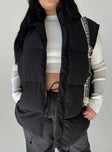 Puffer vest High neck Quilted stitching Zip front fastening  Twin hip pockets Adjustable toggles at hem