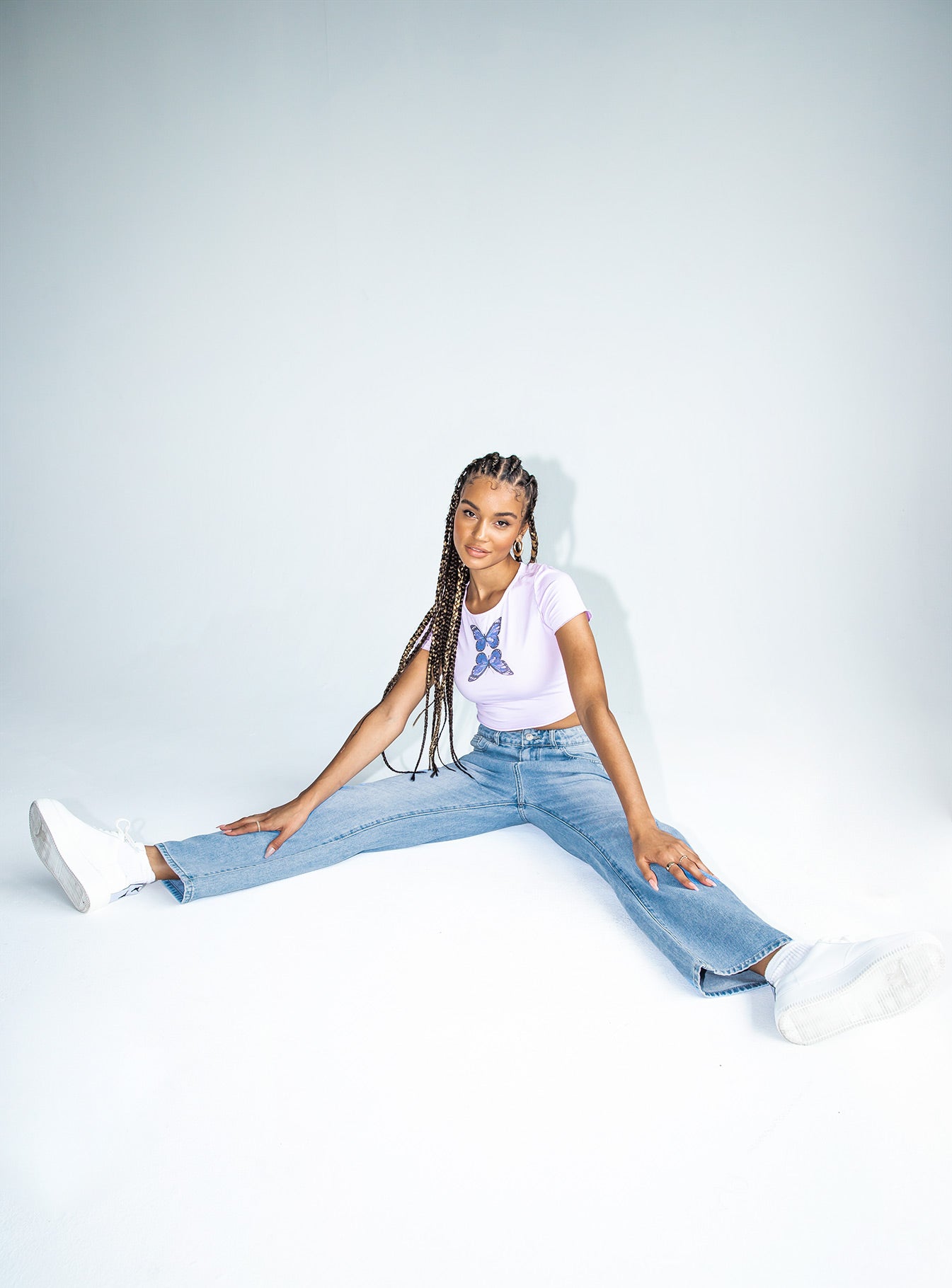 side view of model wearing Princess Polly Naomi Mid Rise Straight Leg Jeans Mid Wash Denim Mid Rise 