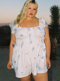 Romper 100% cotton Floral print  Elasticated shoulders & neckline  Tie at bust  Shirred waist 