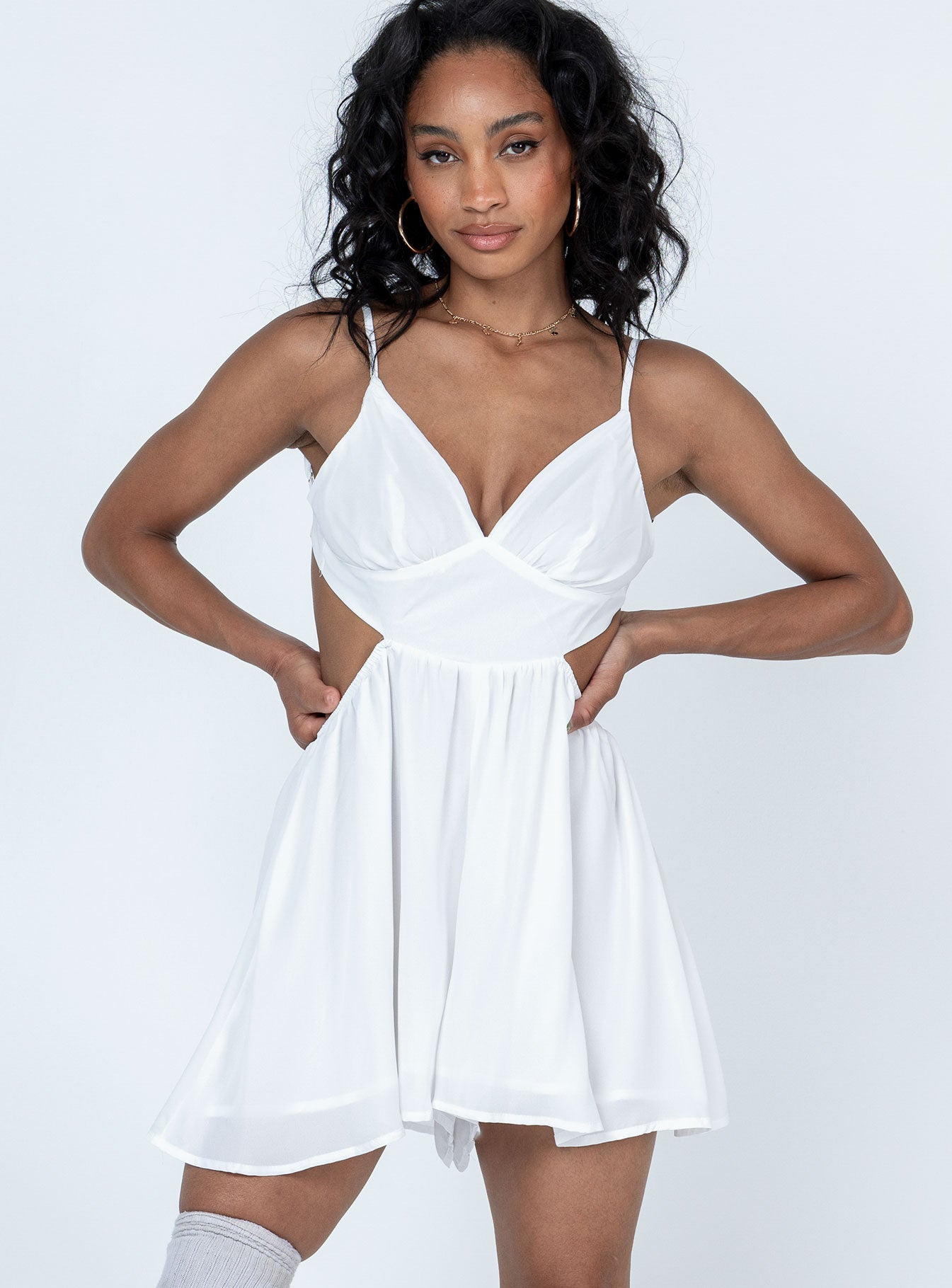White romper Adjustable shoulder straps  Gathered bust  Tie fastening at back  Exposed back  Elastciated wiast 