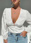 front view of model wearing Princess Polly Traylen Long Sleeve Top White Full Sleeves Plunger 