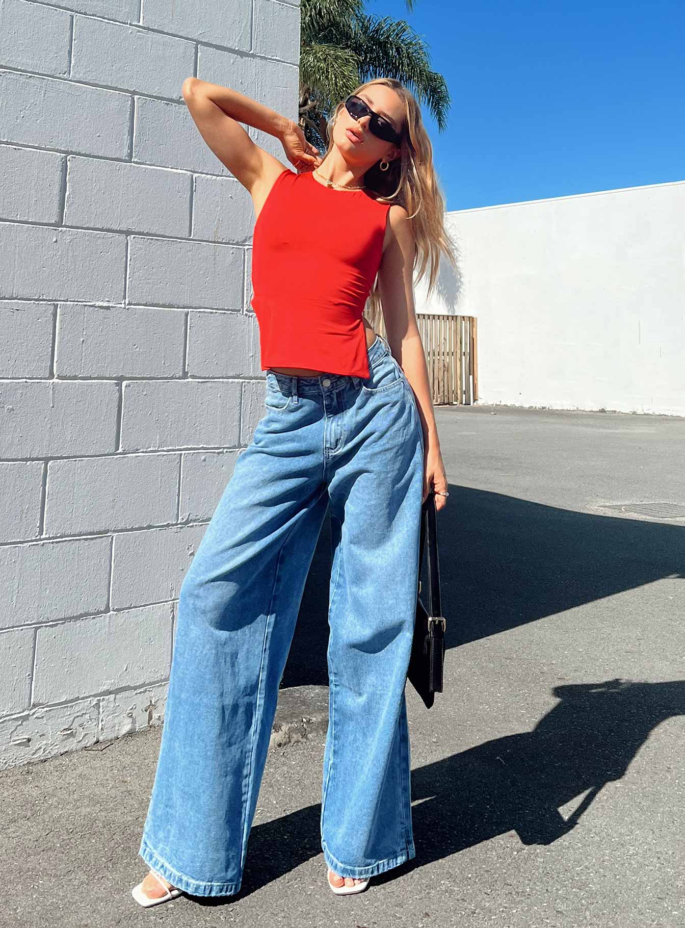 Front view of model wearing  front Princess Polly Mid Rise  Locke Wide Leg Jeans Mid Wash Denim