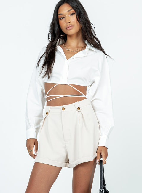 Shorts High waisted  Zip & button fastening  Belt looped waist  Pleated waist  Fixed rolled hem 