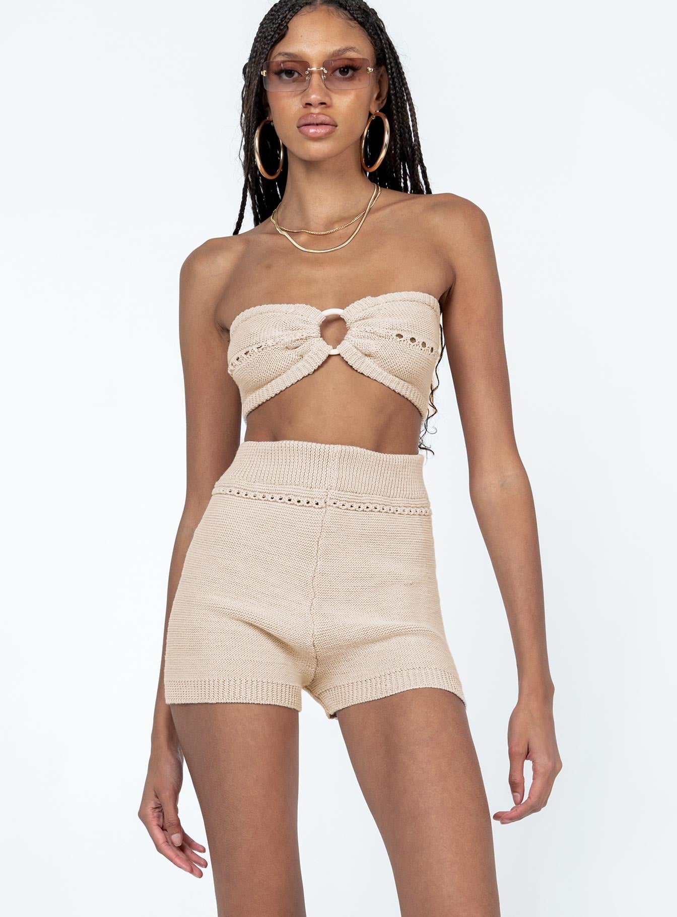 Matching set Soft knit material  Strapless crop top  Ring detail at bust  High waisted shorts  Elasticated waistband  Fitted at leg 