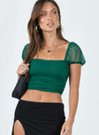 side view of model wearing Princess Polly City Lights Crop Top Green Short Sleeves Square Neck 