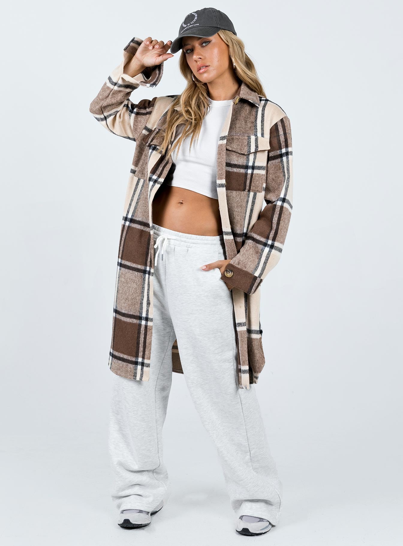 Coat Plaid print Classic collar Button fastening at front Twin chest pockets Single button cuff