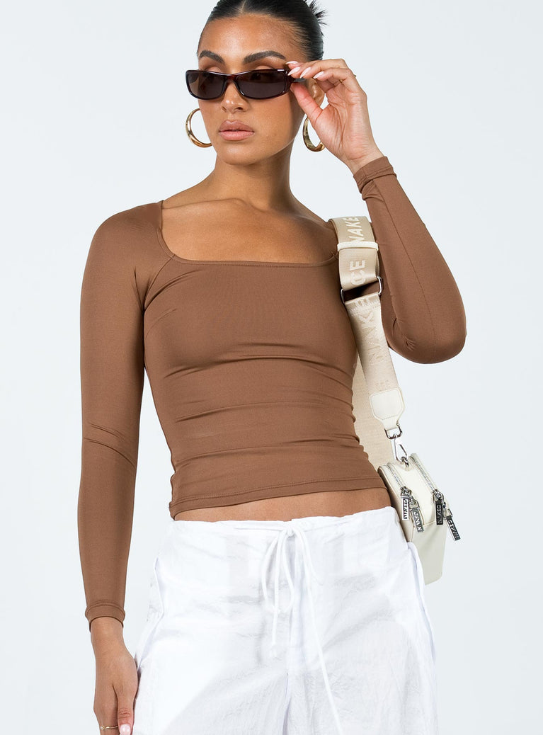 Front view of model wearing  front Princess Polly Full Sleeves Square Neck  Powell Long Sleeve Top Brown