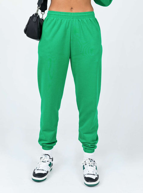 back view of model wearing Princess Polly Club Basic Trackpants Green 