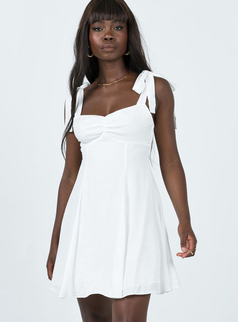 Front view of model wearing  front Princess Polly Asymmetric Neckline  Kinley Mini Dress White