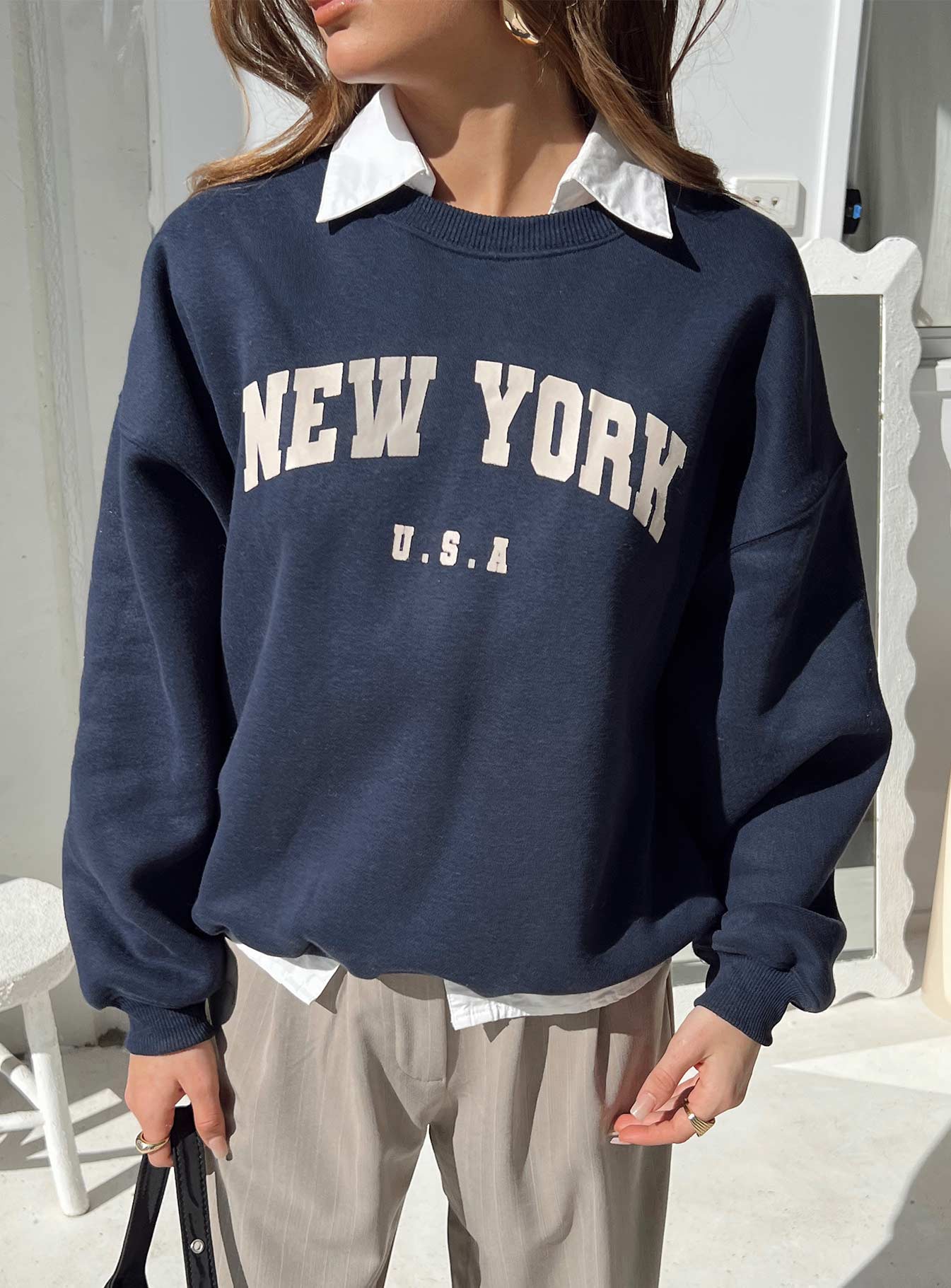 front view of model wearing Princess Polly New York Crewneck Sweatshirt Navy regular 