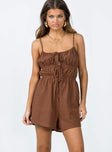 Romper Textured material  Double tie front fastening  Elasticated waist  Twin hip pockets 