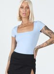 front view of model wearing Princess Polly Chavis Bodysuit Blue Short Sleeves Square Neck 