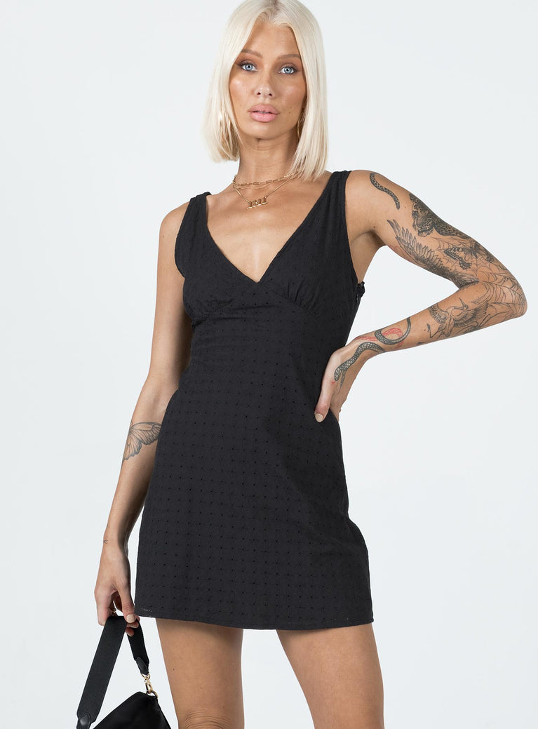 Front view of model wearing  front Princess Polly V-Neck  Nellie Mini Dress Black Anglaise