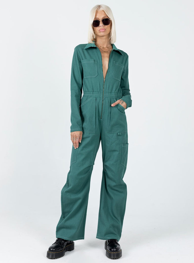 Boiler suit 100% cotton Relaxed fit Contrast stitching  Classic collar  Zip front fastening  Twin chest pockets  Six leg pockets  Elasticated waistband   Wide leg  Pleated detail at inner leg 