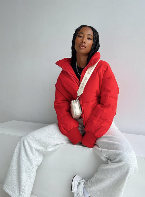 Puffer jacket High neck Zip front fastening Twin zip front pockets Ribbed cuffs Drawstring waist