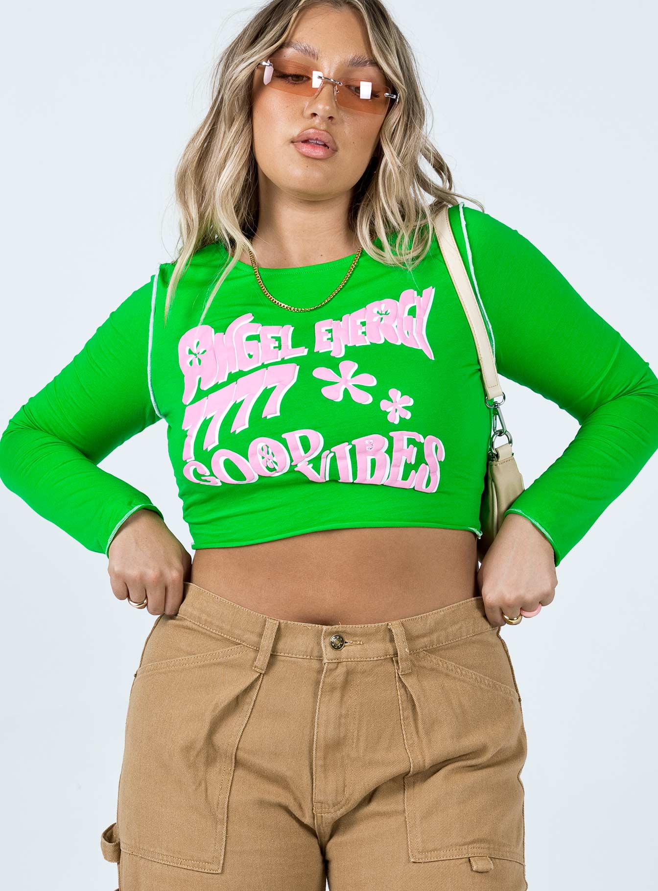 front view of model wearing Princess Polly Good Vibes Long Sleeve Top Green 