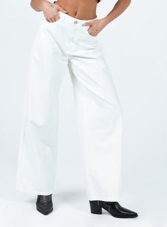Front view of model wearing  front Princess Polly Mid Rise  Patridge Wide Leg Jeans White
