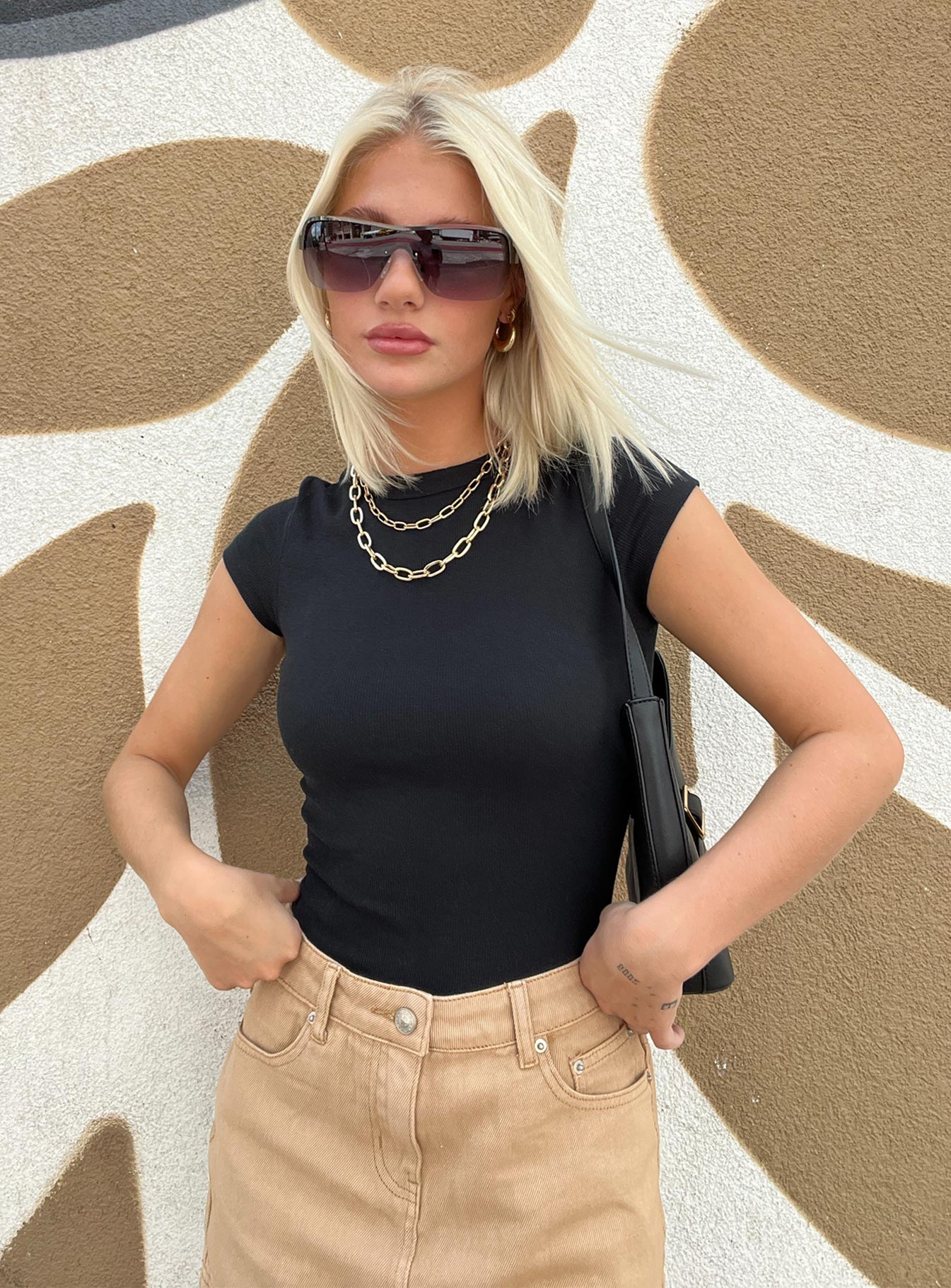 front view of model wearing Princess Polly Harlea Bodysuit Black Short Sleeves Crew Neck 