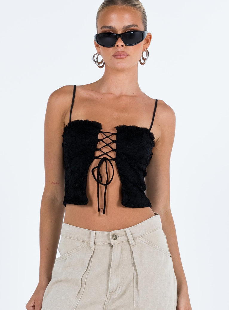 Crop top Lace material  Ruffle neckline  Adjustable shoulder straps  Inner silicone strip at bust  Lace up fastening at front Non stretch Fully lined 