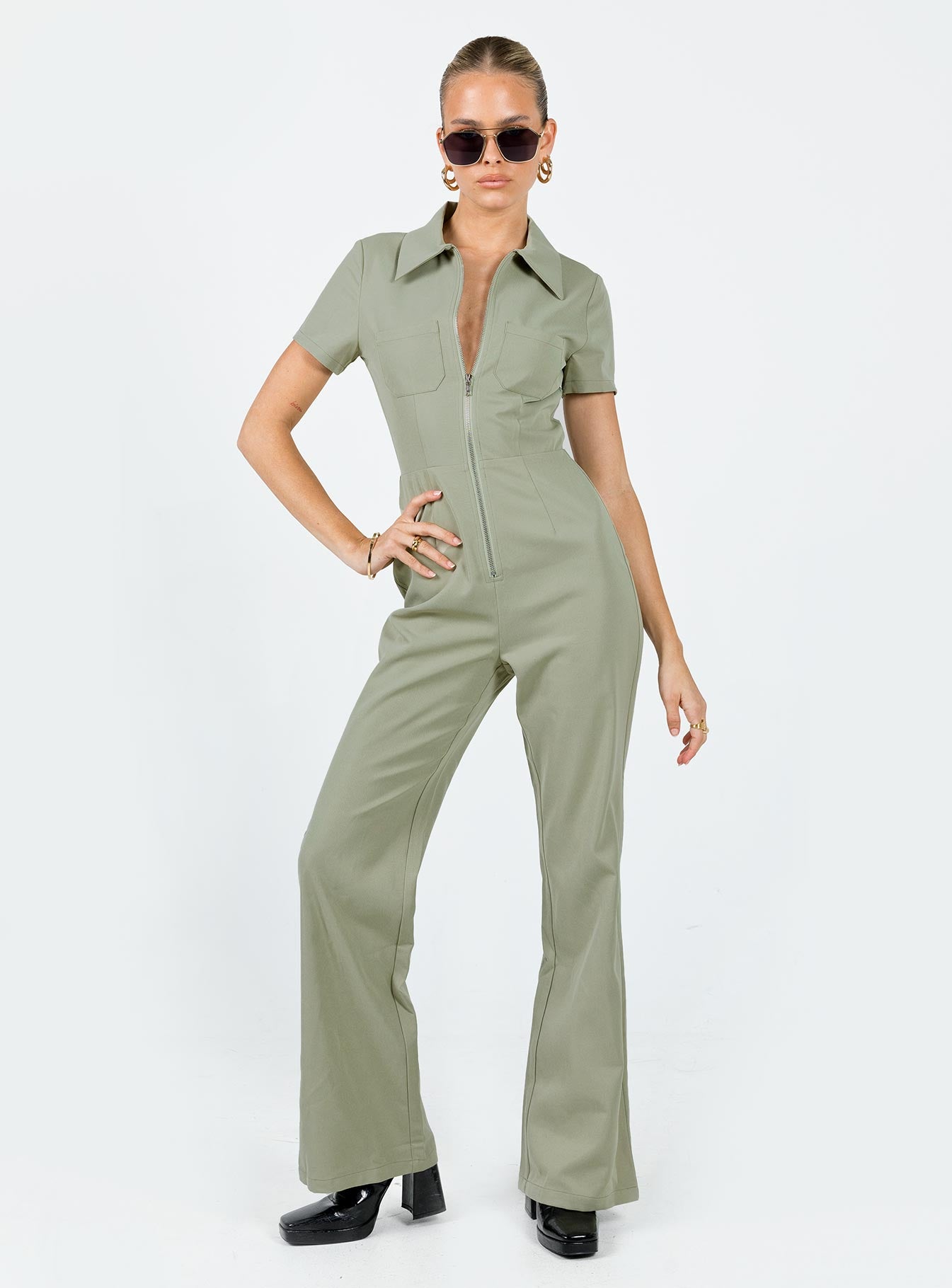 Jumpsuit Classic collar Zip fastening at front Twin chest pockets Straight leg