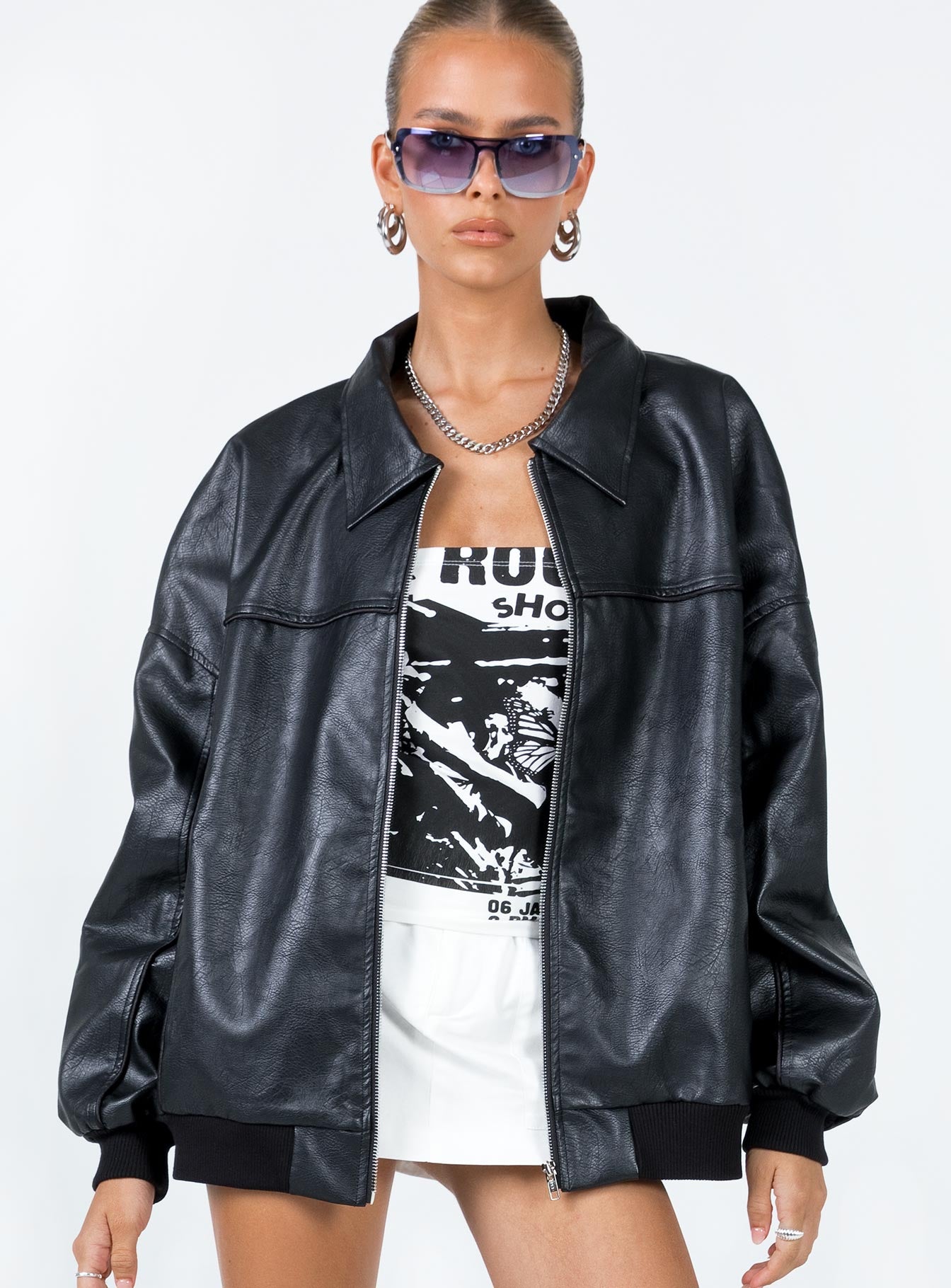 Bomber jacket  Oversized fit  Main: 55% rayon 45% polyester  Lining: 100% polyester  Faux leather material  Classic collar  Zip front fastening  Ribbed waistband & cuffs  Twin hip pockets 