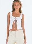 White top Sheer knit material Scoop neck Double tie fastening at front Good Stretch Unlined 