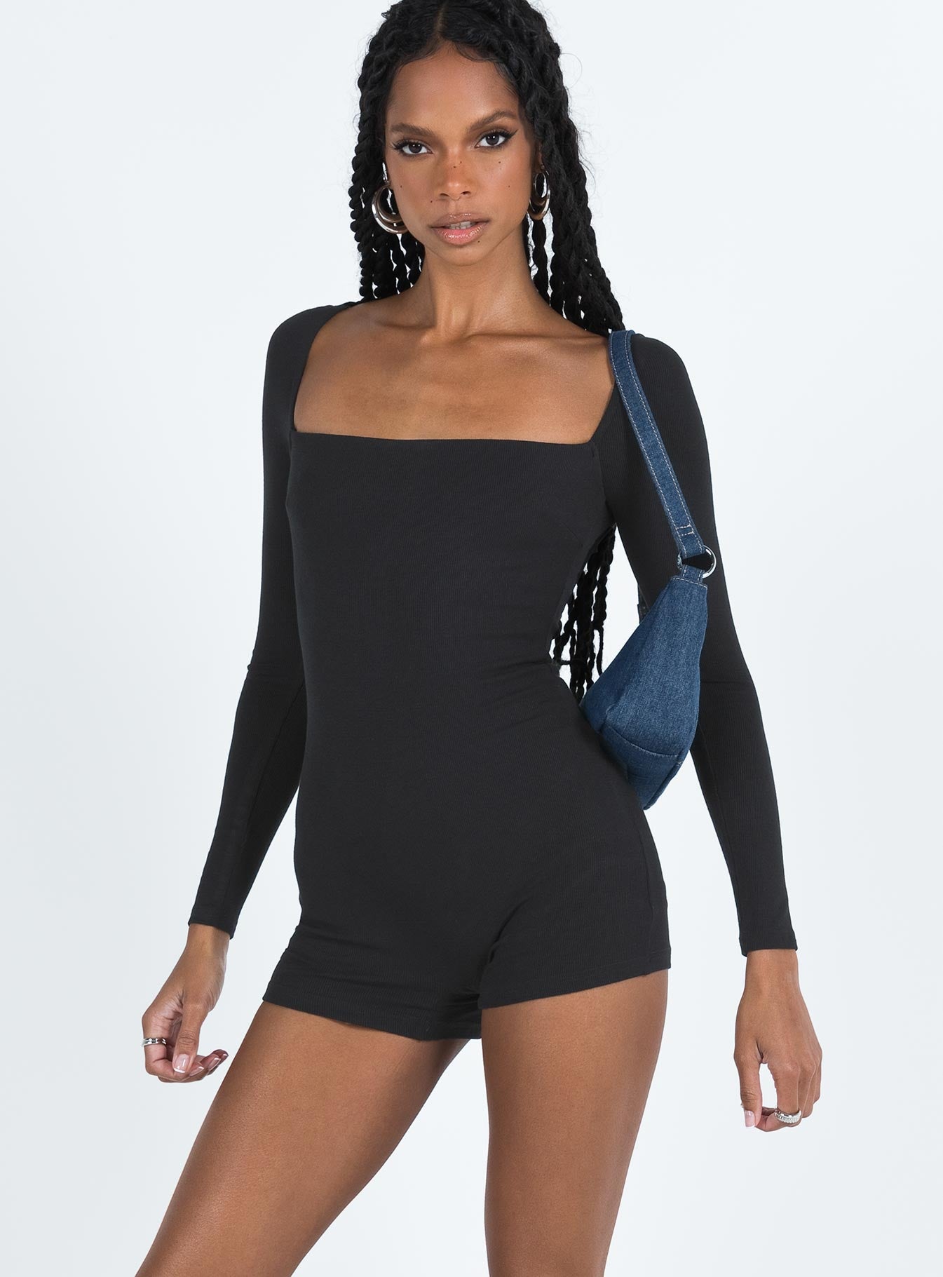 Black long sleeve playsuit Ribbed material Square neckline Invisible zip fastening at back Good stretch