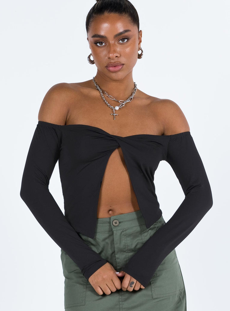 Black top Off the shoulder design Inner silicone strip at bust Split hem Good stretch Partially lined