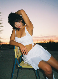 Matching 3 piece set Singlet top  Low scoop neckline  Strapless crop top  Adjustable tie fastening at bust  High waisted mini skirt  Adjustable tie ruching at sides of top & skirt  