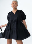 front view of model wearing Princess Polly Braxton Mini Dress Black V-Neck 