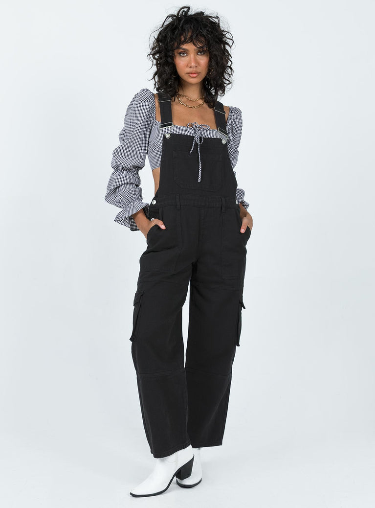 Overalls Denim material Adjustable shoulder straps  Chest pocket  Belt looped waist  Invisible zip fastening at side Four-pocket design  Cargo style leg pockets Wide leg