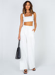 Matching set Crop top Fixed straps Invisible zip fasting at side High waisted pants Wide relaxed leg Belt loops at waist Zip & button fastening Stuble pleats at waist Twin hip pockets