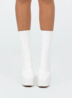 Boots  Faux leather material  Fitted at leg  Block heel  Platform base  Square toe  Slight stretch 