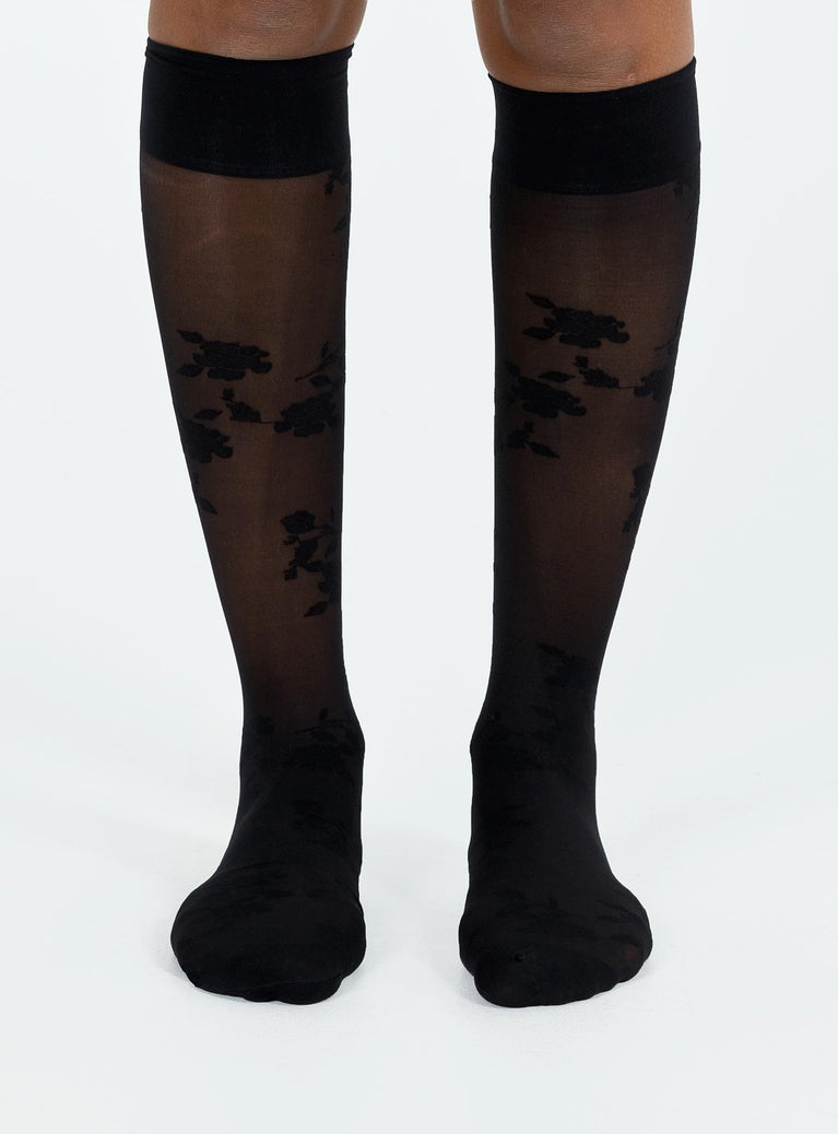 Black stockings Sheer material Floral print Thigh high design Good stretch Hand wash only 