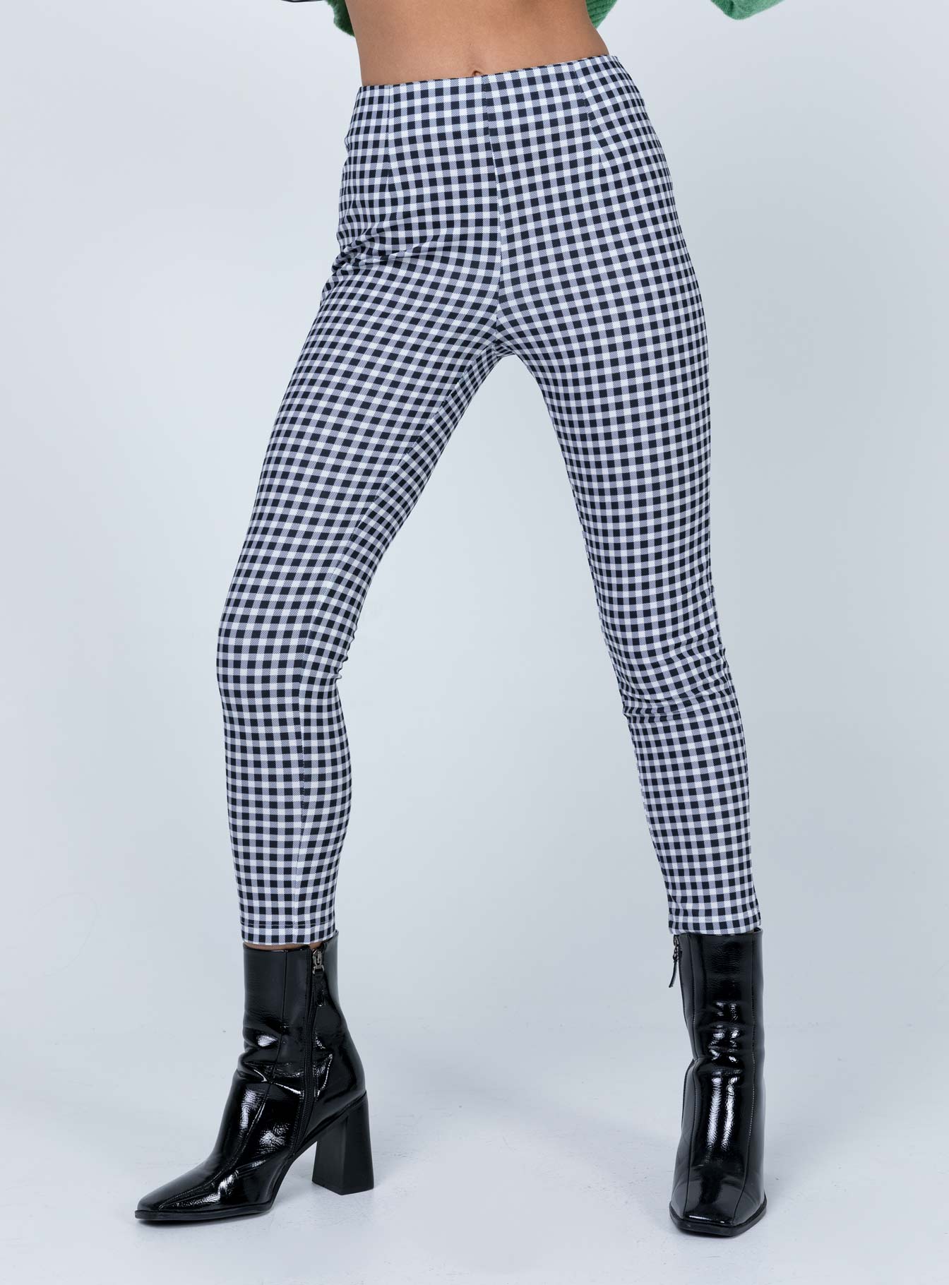 side view of model wearing Princess Polly Iggy Gingham Pants Black/White 